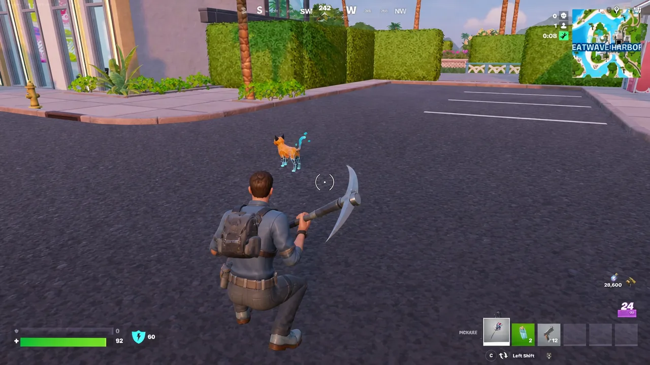 Player facing the glowing Fractal Cat sidekick on a street during a Fortnite match