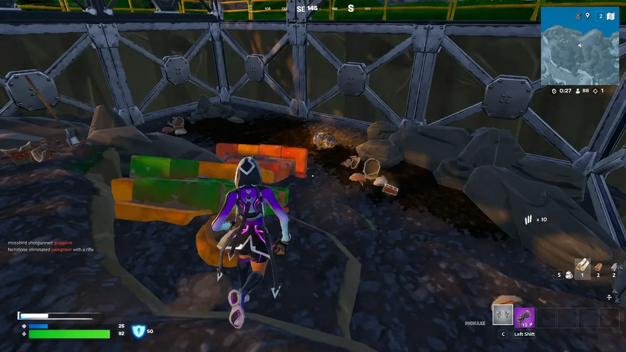 Player in the Kinetic Catalyst outfit approaching ground loot while holding the Striking Stars pickaxe