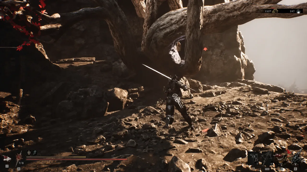 Player character with sword drawn moving across the rocky ledges below Outskirts of Mammon