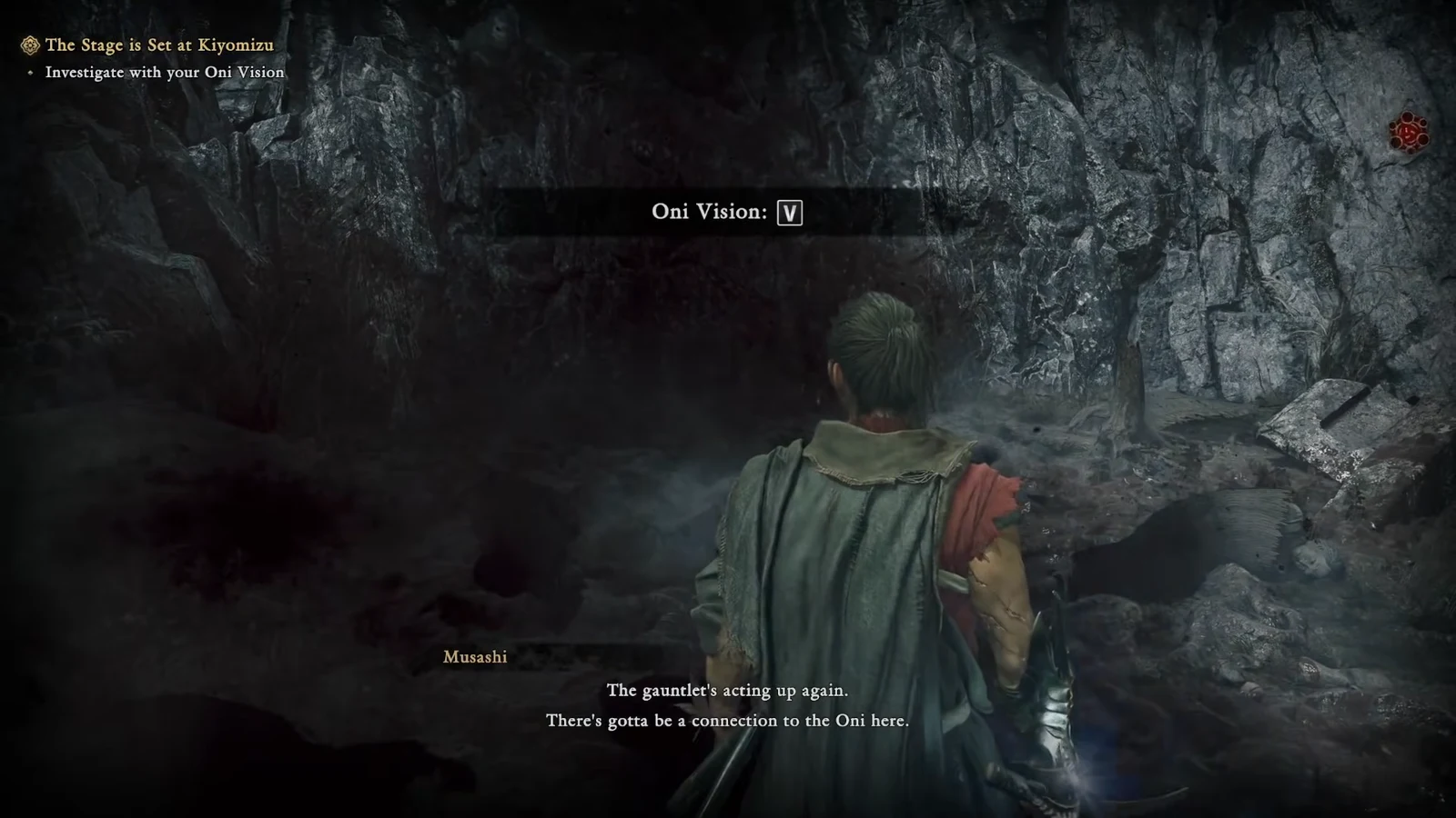 On-screen prompt instructing the player to press V to use Oni Vision