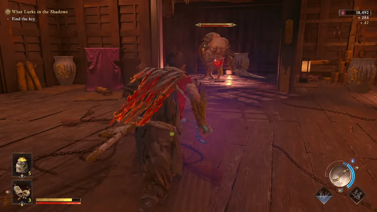 Musashi locked onto a large Genma in a room while the objective marker sits in the corner of the HUD