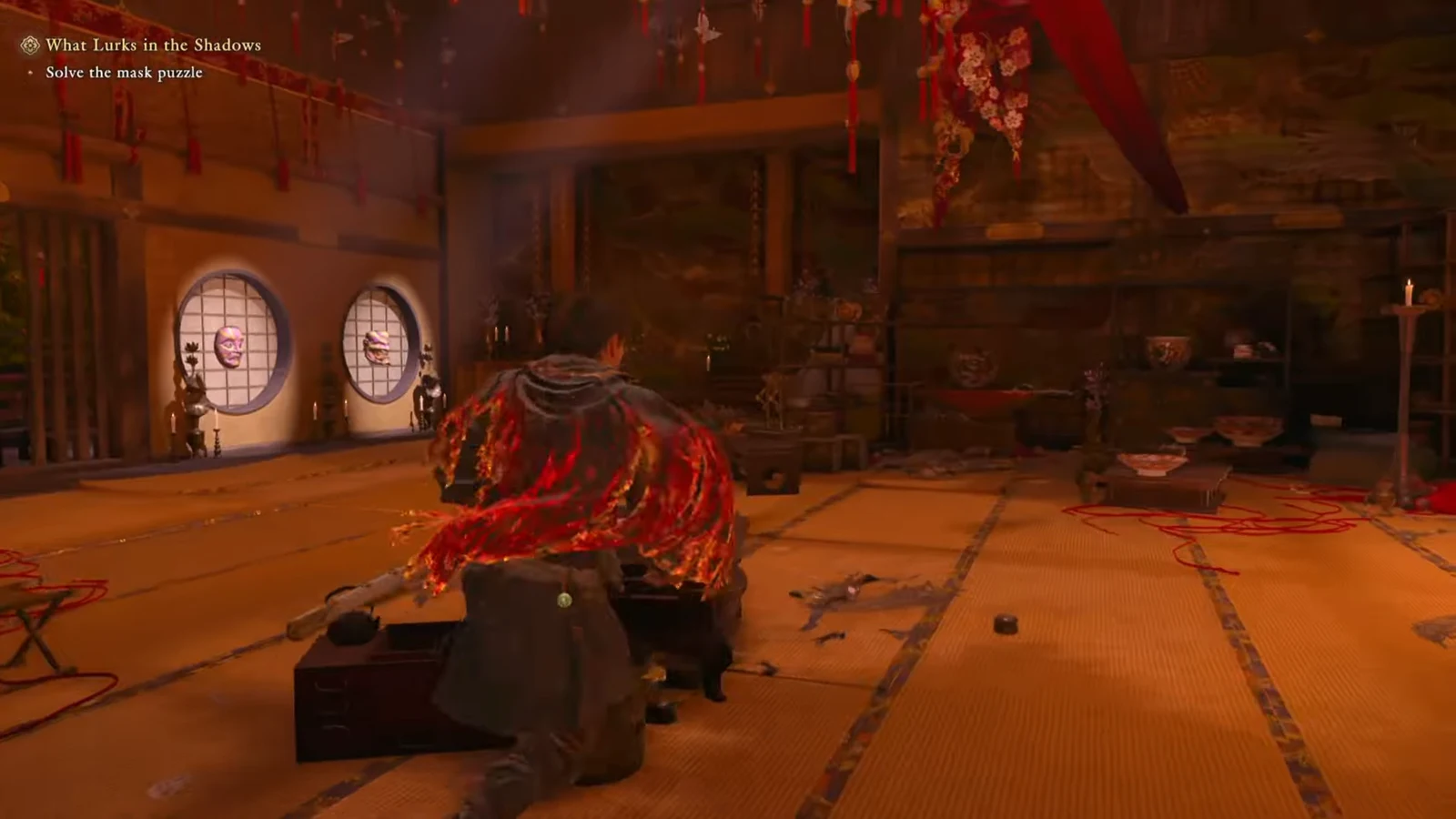 Two masks mounted on circular windows during the mask puzzle room