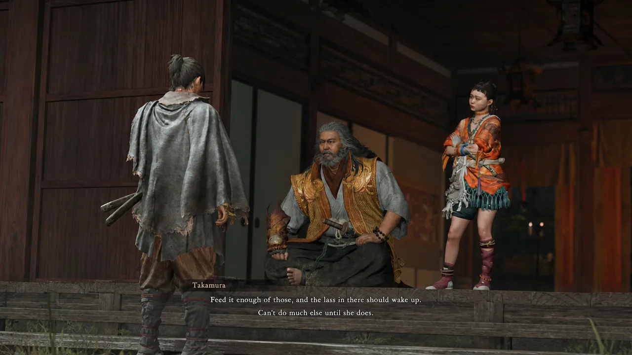 Takamura speaking in subtitles as three characters talk inside a wooden building