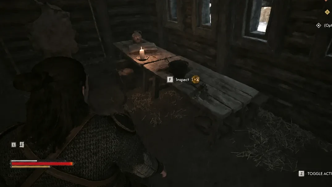 The F Inspect prompt highlighted next to the cooking pot on the cabin table