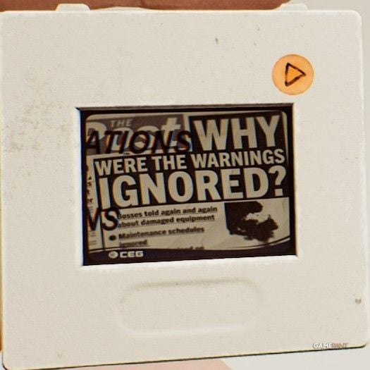 Projector Slide D showing newspaper headlines
