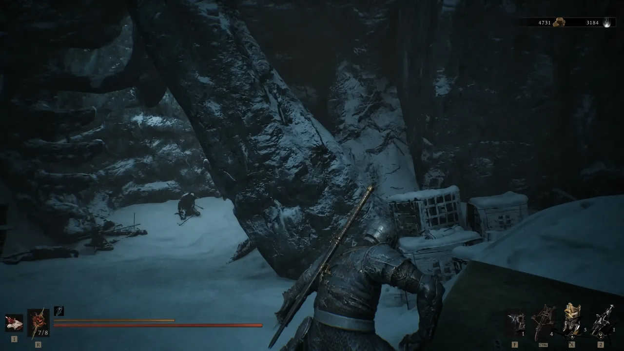 Player character crossing a snow-covered cavern route toward the bridge