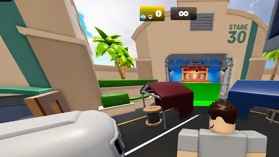 Player moving through an obstacle course toward a green-lit stage entrance