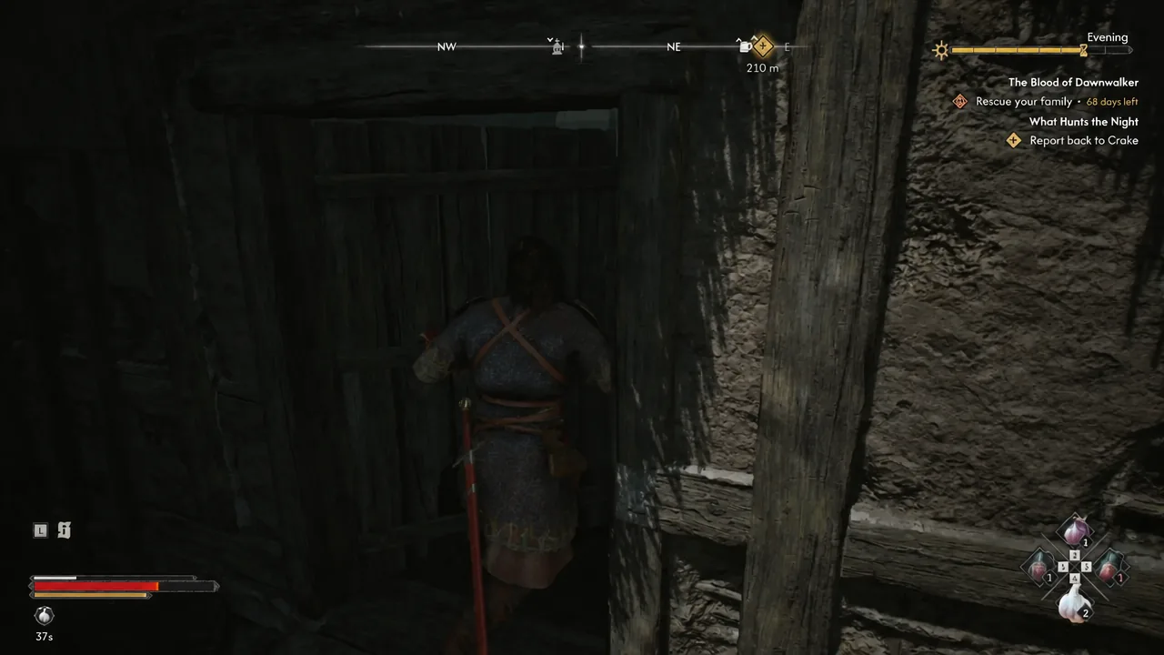 Coen pushing open a wooden door with the quest objective still tracked on screen