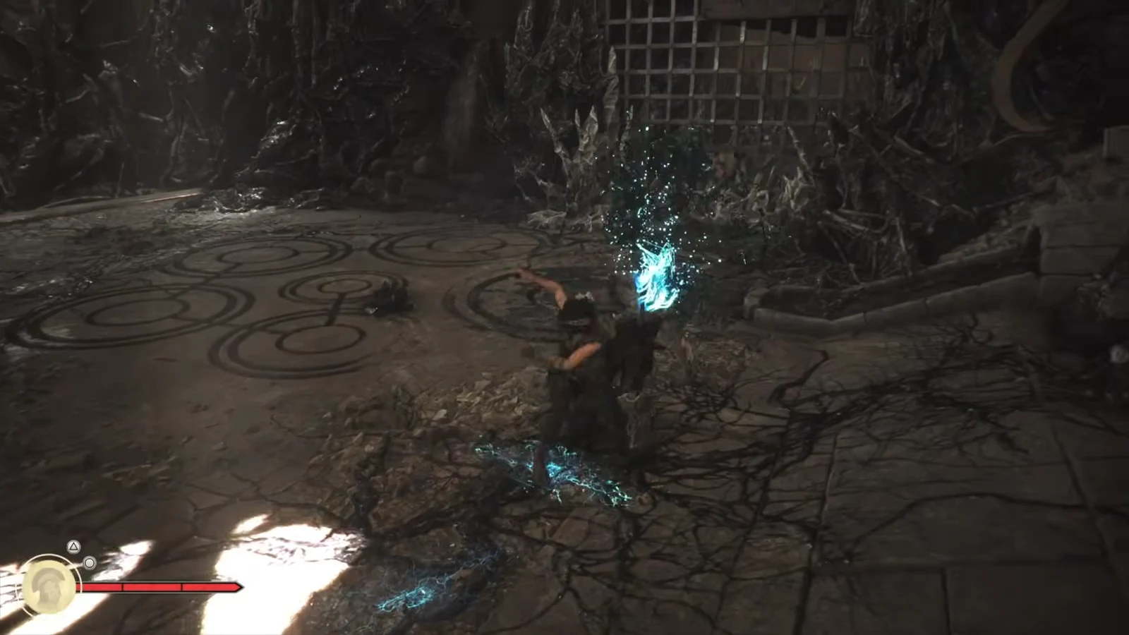 Sophia swings her sword at a glowing enemy inside a dark cavern arena, health bar visible