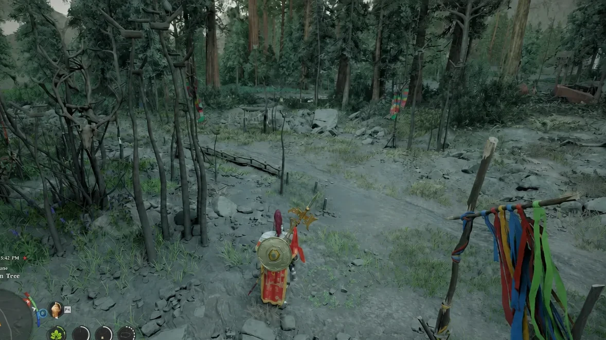 Kliff walking a wooded path toward the Dunguan Tree while carrying a ribbon-wrapped staff