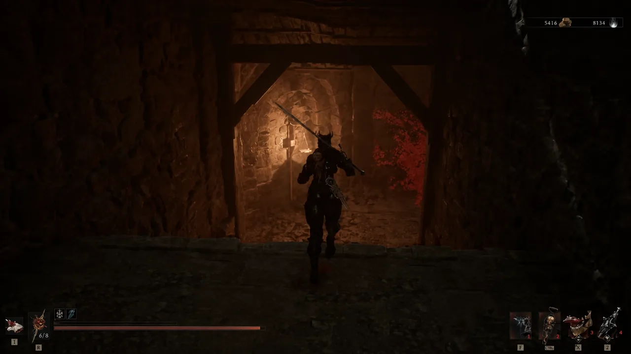 Player character advancing through a torch-lit stone passage inside the dungeon