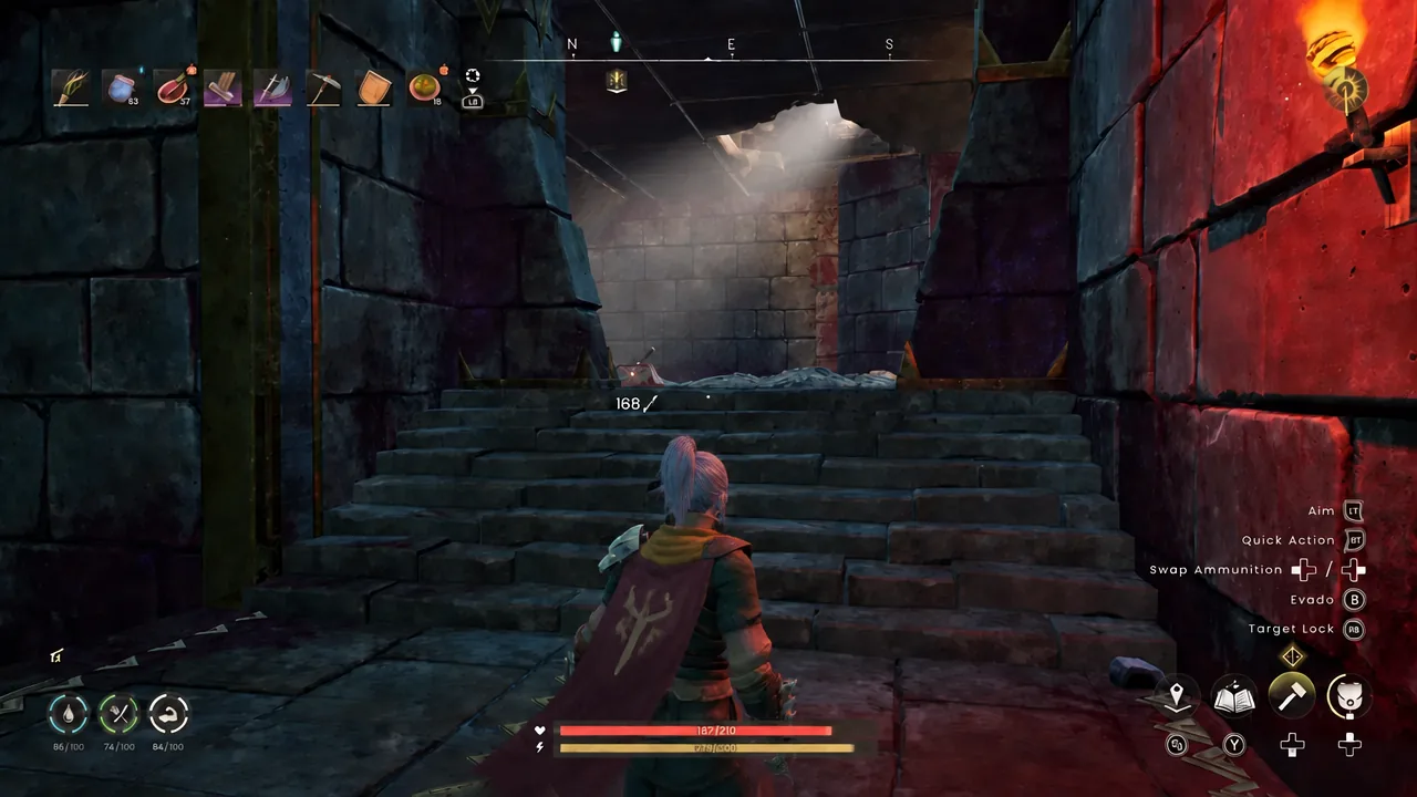 Player running up a stone staircase inside the vault towards the upper ruins level