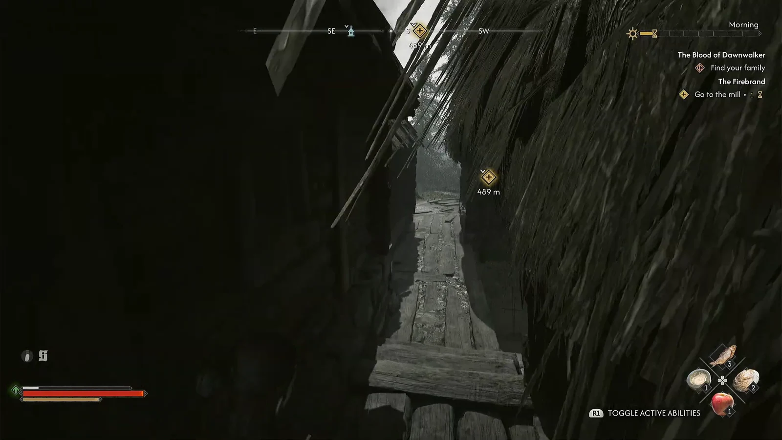Coen moving through a narrow wooden passage with the Go to the mill objective marker 489 meters away