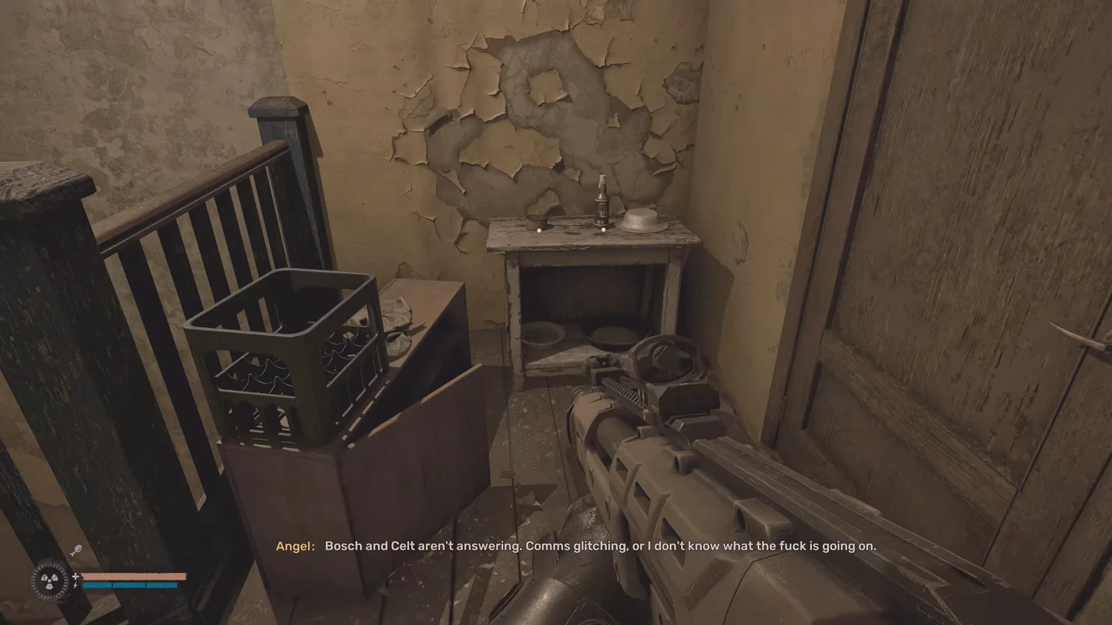 First-person rifle aimed at a small table inside a decaying apartment room