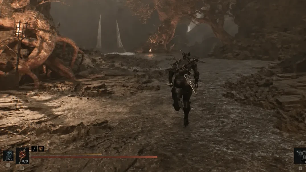 Armored character sprinting through a rocky mine tunnel with equipped item slots on screen