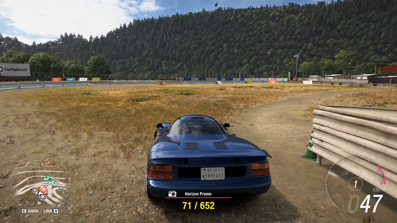 Blue Jaguar driving away from the track with Horizon Promo progress on the HUD