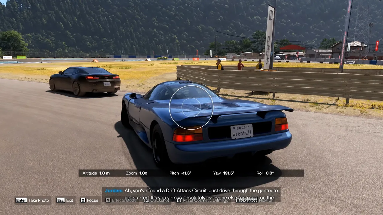 Photo Mode camera controls framing a blue Jaguar with the focus setting highlighted