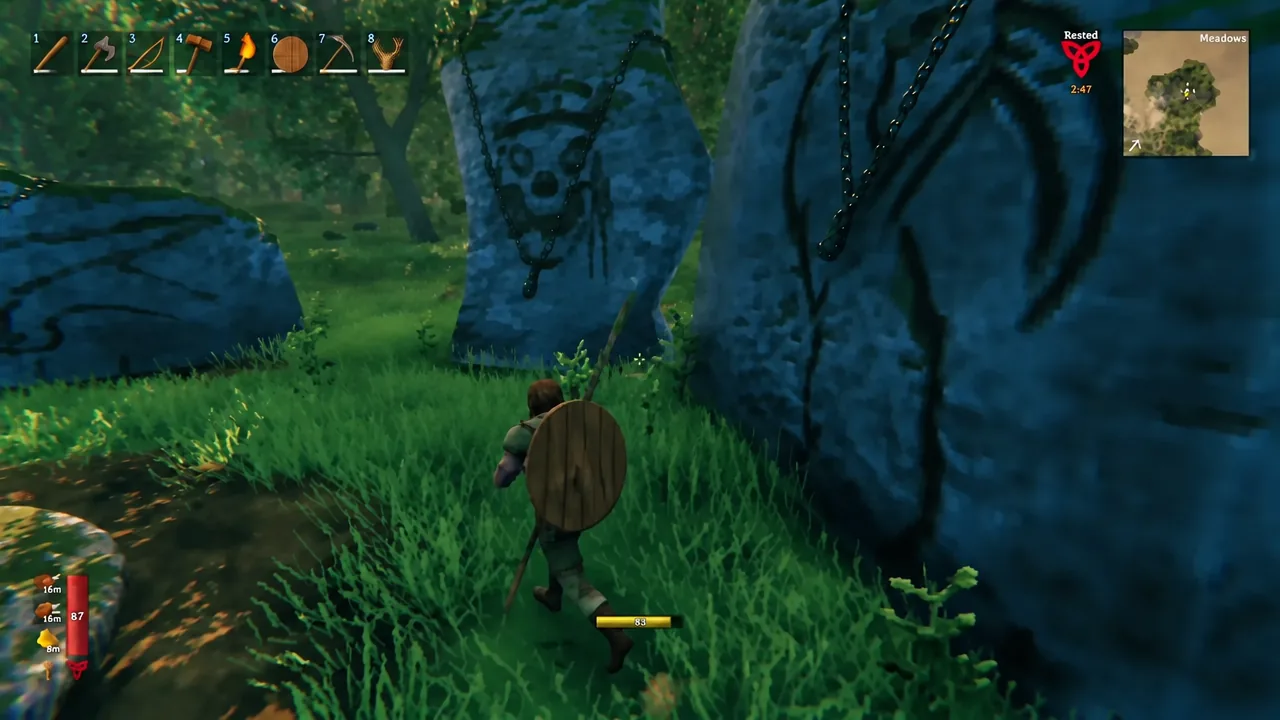 A Viking travels through the Meadows past chained standing stones, with hotbar and minimap on screen