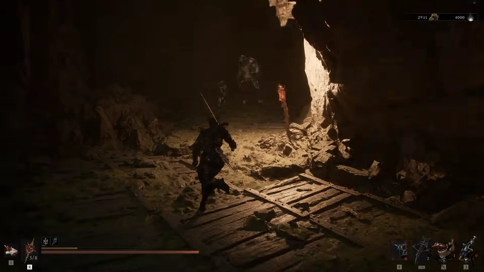 Armed character advancing through a torchlit cave toward enemies with the combat HUD visible
