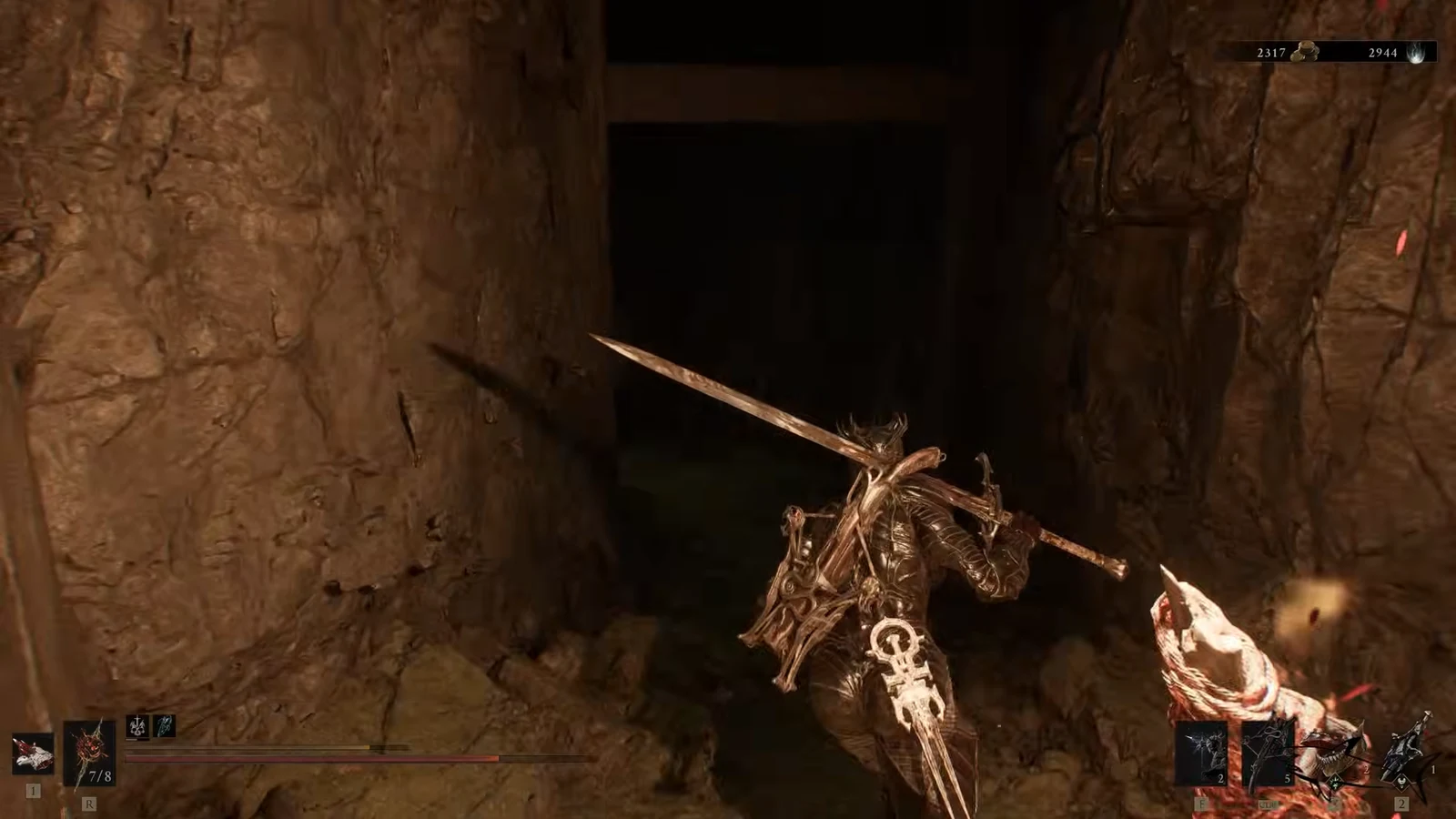 Armored character with a sword moving through a dark stone passage inside the hideout
