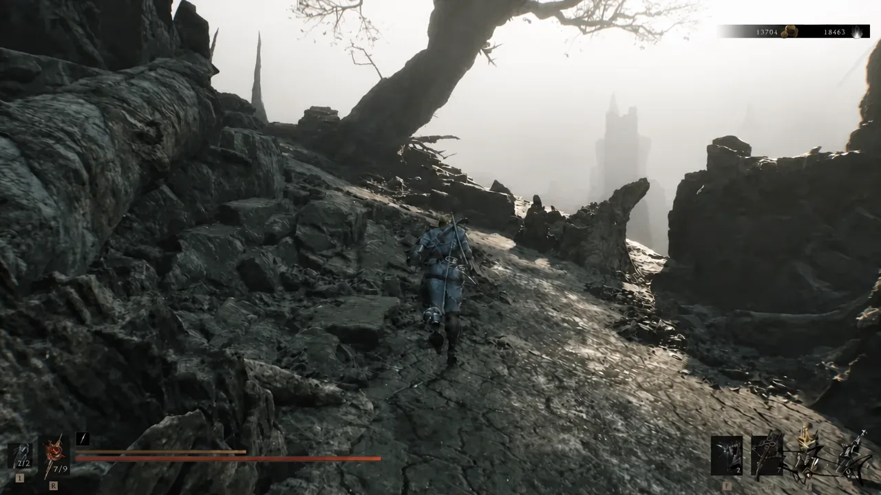 Player character running along a rocky path in the Ruins of Mammon toward the dungeon entrance