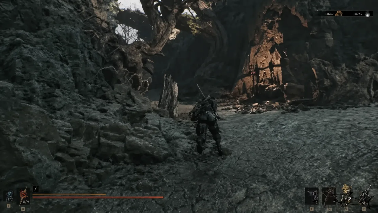 Player character running through the rocky cavern corridor leading down into the dungeon