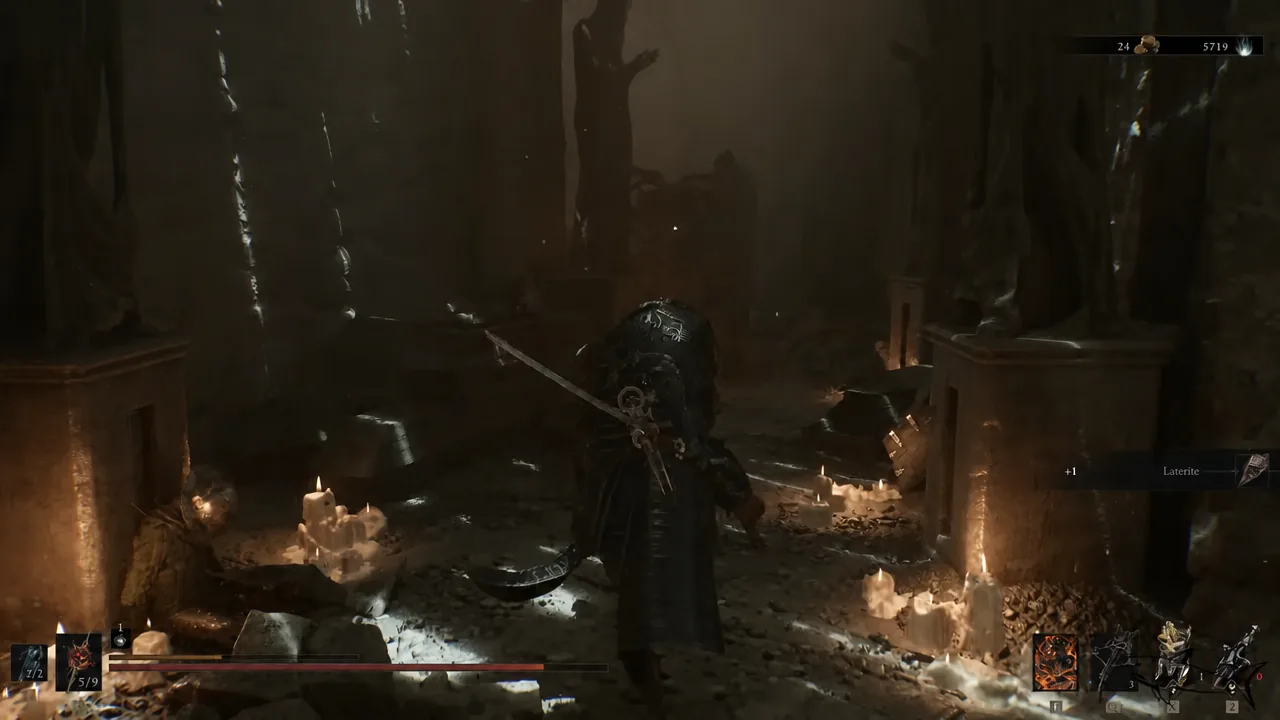 Laterite pickup notification appearing while standing in the candlelit burial chamber