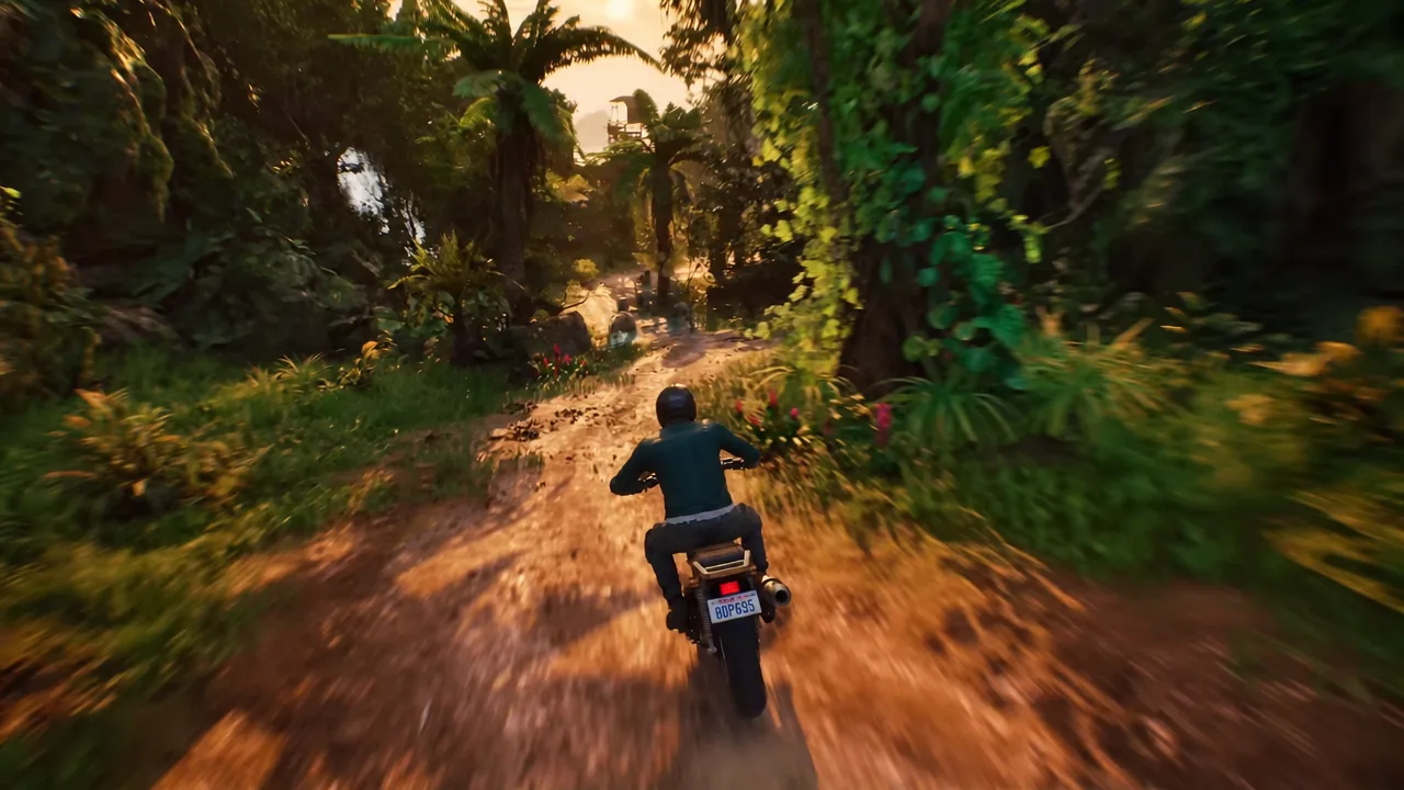 Motorcycle riding down a jungle trail toward open sunlight during a stunt run