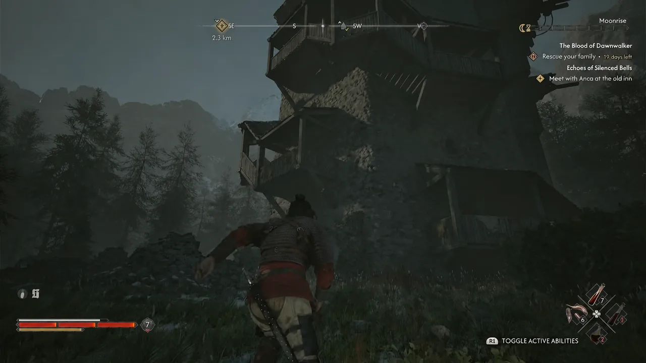 Coen approaching the tall stone tower on the mountainside at night, with the ability prompt on screen