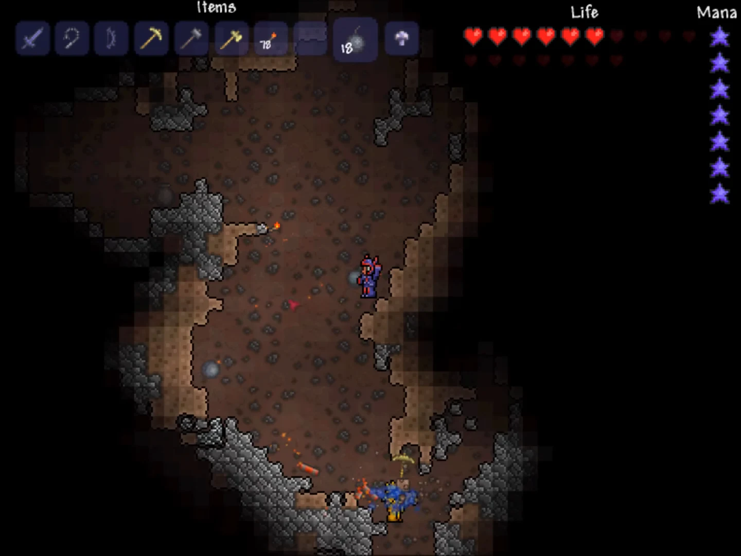 A player character explores and mines through a deep underground stone cavern surrounded by exposed ore and tunnels.