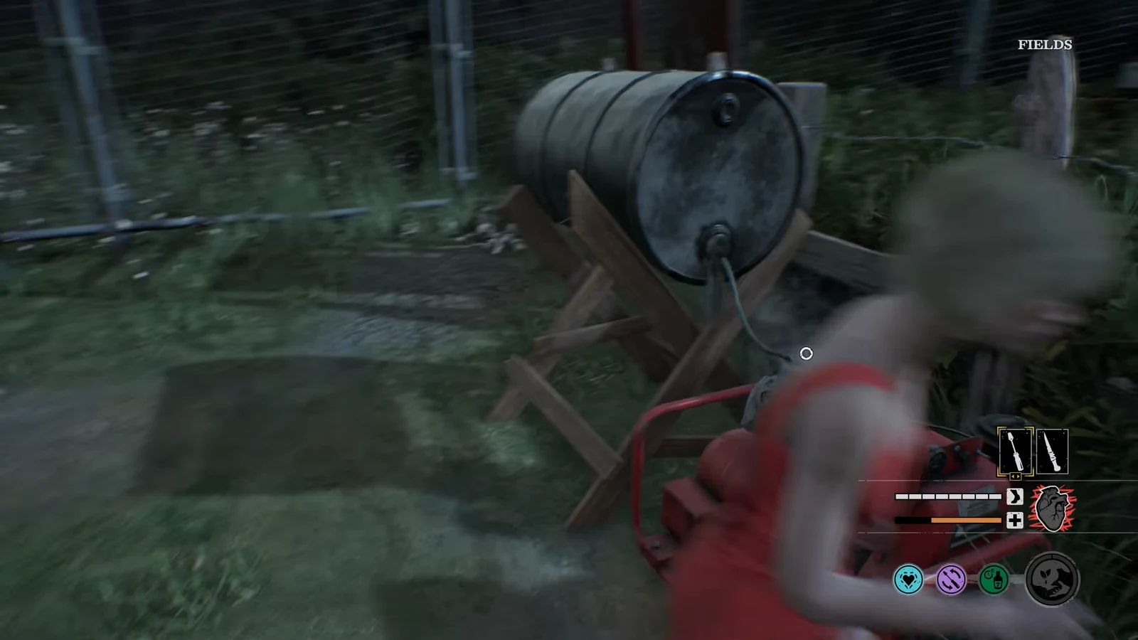 Player lining up an interaction with a valve and cable on a metal barrel out in the Fields