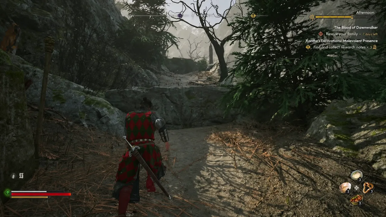 Coen moving along a mountain path toward the highlighted quest objective marker