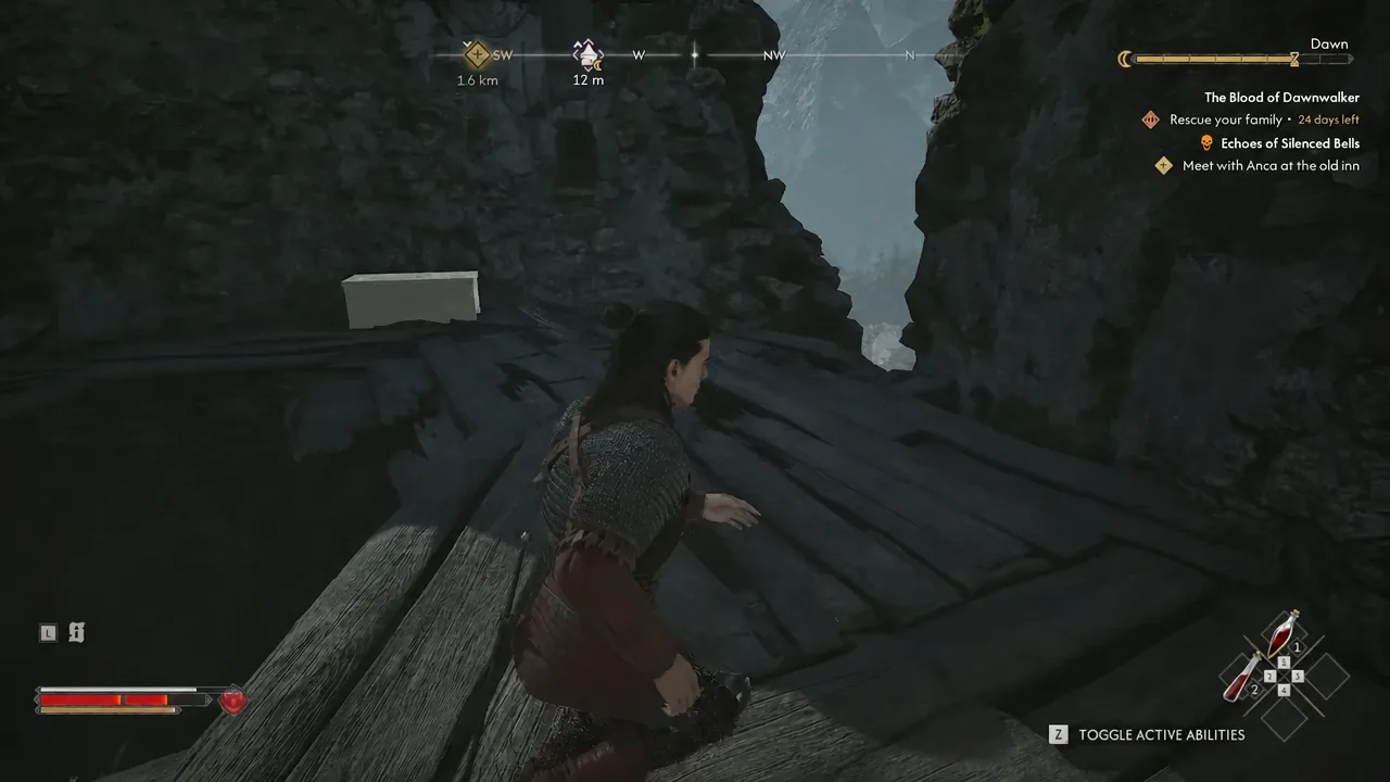 Character crossing a wooden platform between rock faces with a 12 m compass marker ahead