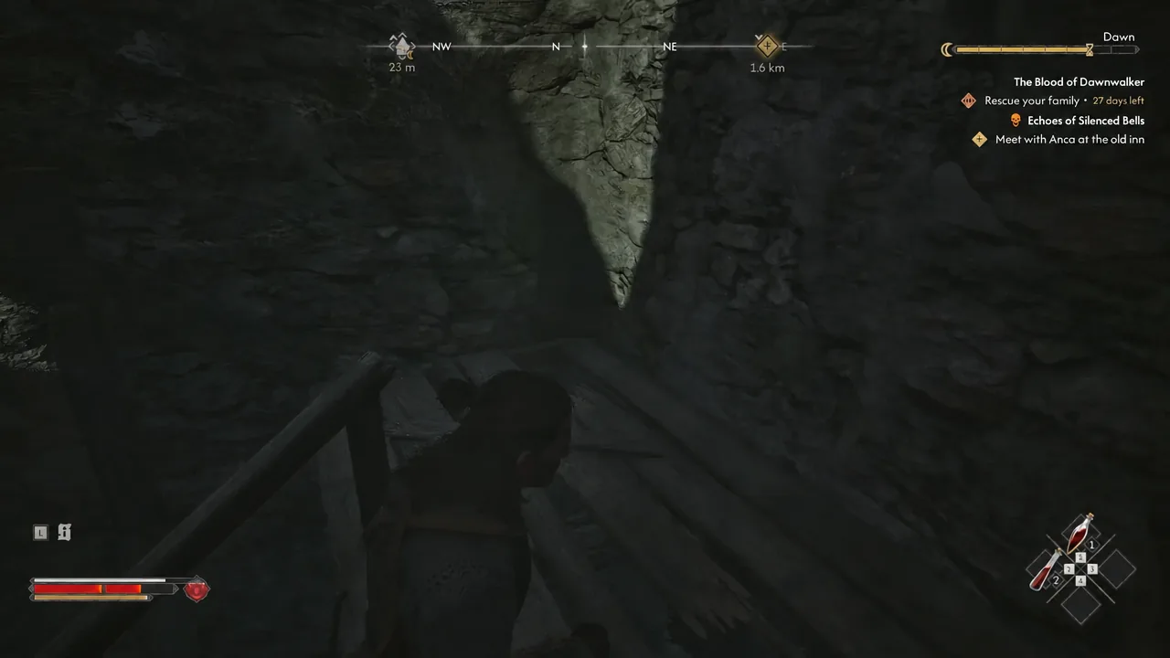 Dark rocky interior passage with the Blood of Dawnwalker objective list shown in the upper right