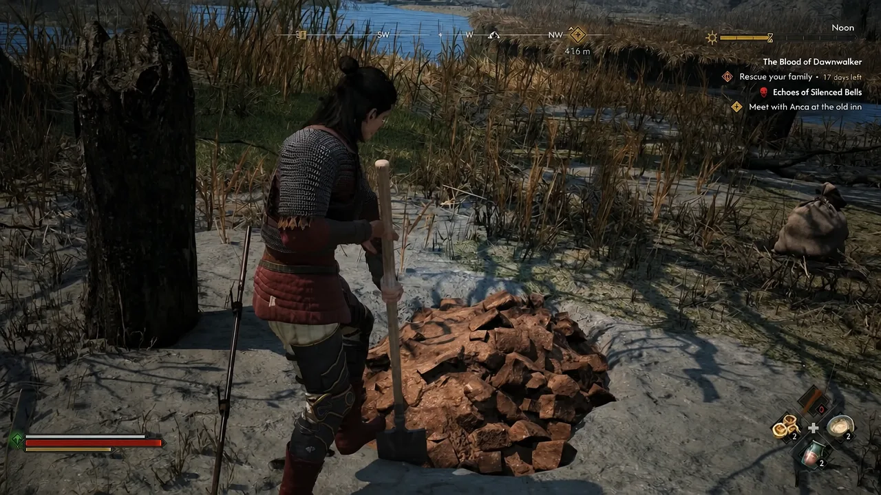 Coen digging into a mound of loose dirt with a shovel