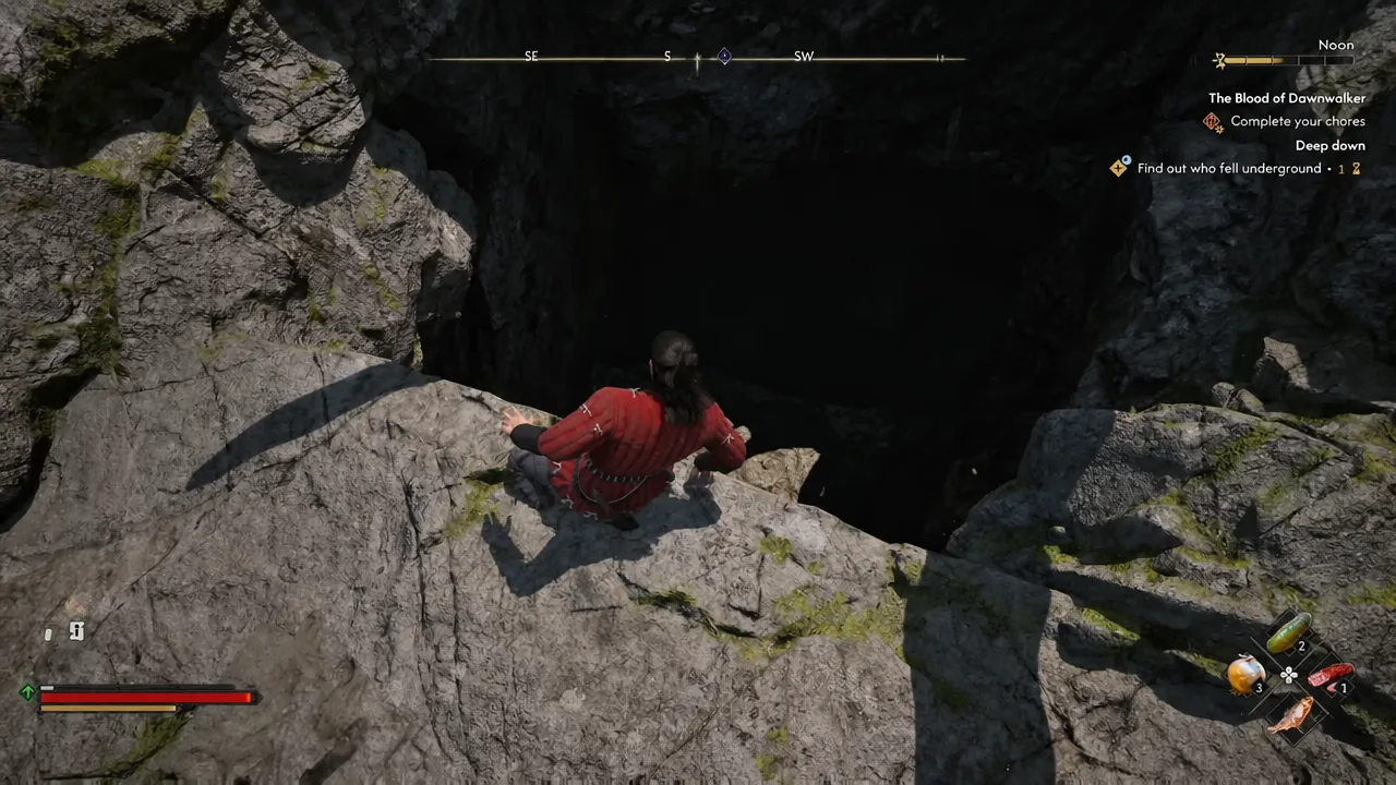 Coen crouched at a dark cave entrance underground with the quest tracker visible on screen