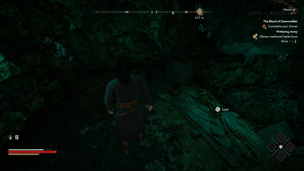 Loot prompt appearing over a body near the chest inside the cave