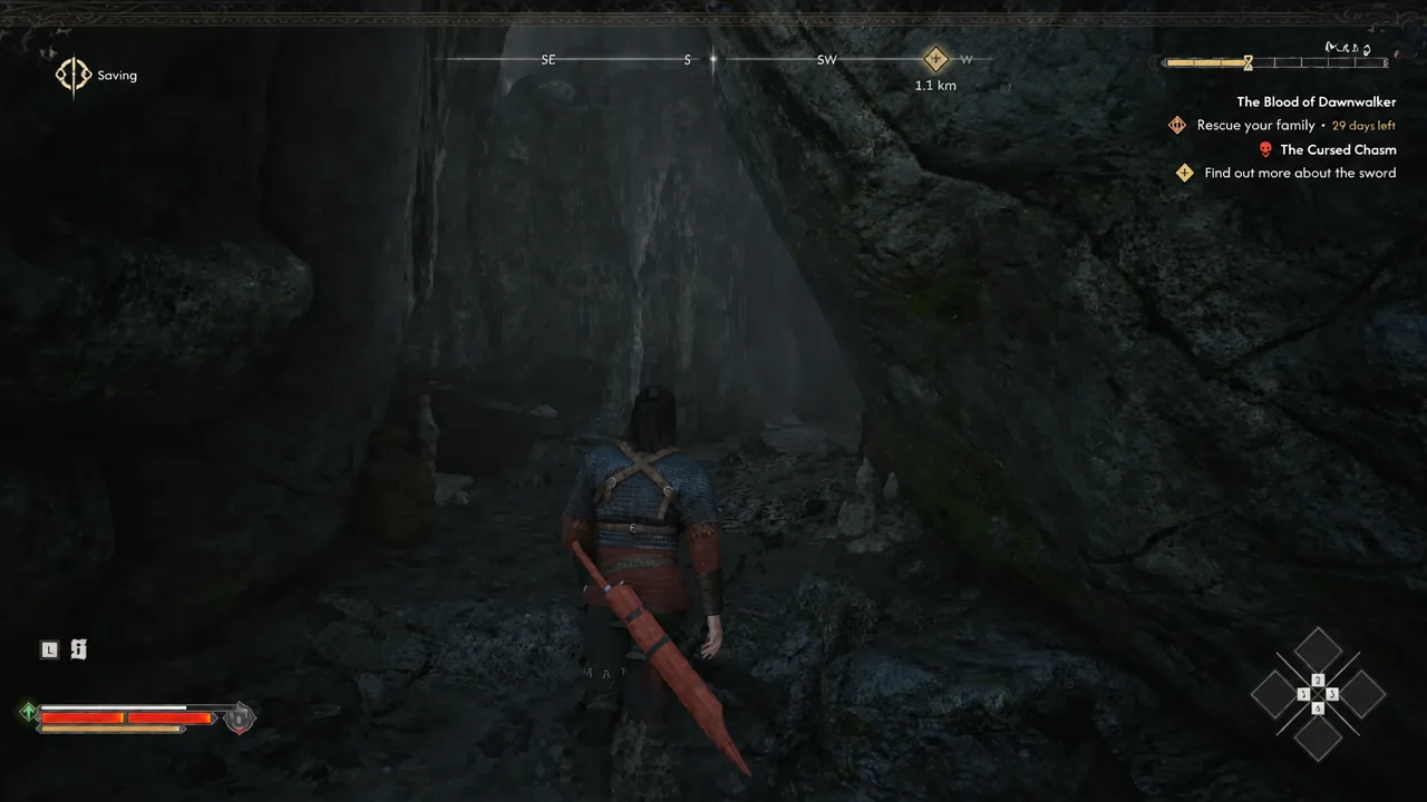 Interior of the hidden cavern behind the waterfall as the autosave indicator appears on screen