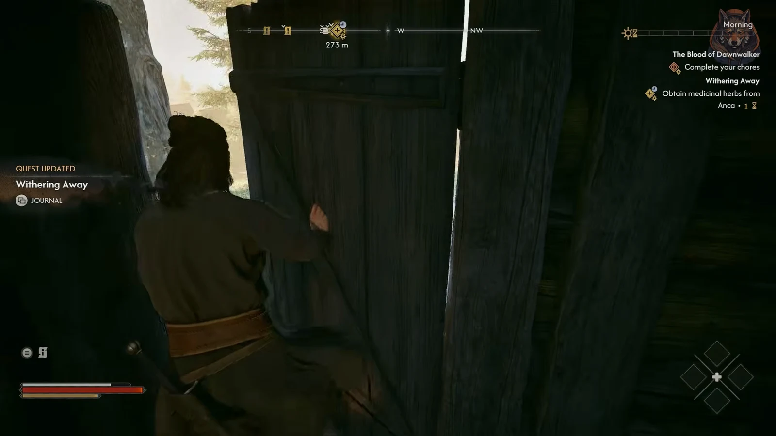Coen pushes open a heavy wooden gate with the Withering Away objective tracked on screen