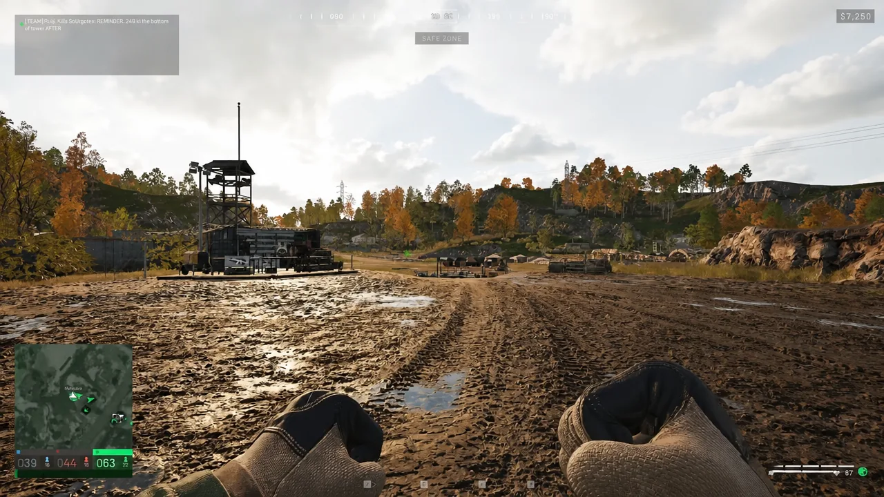 Player crossing a muddy quarry on foot with the safe zone objective marker on the HUD