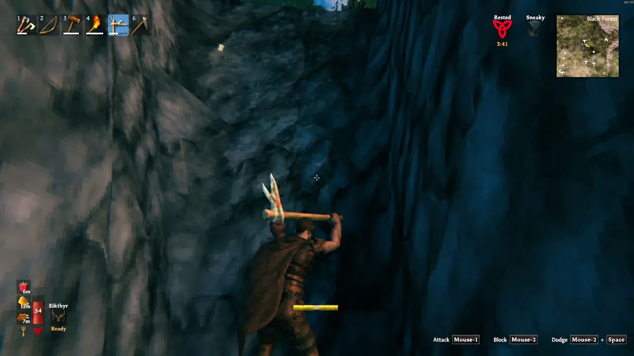 Pickaxe equipped in hotbar slot five while digging into the earth beneath the copper node