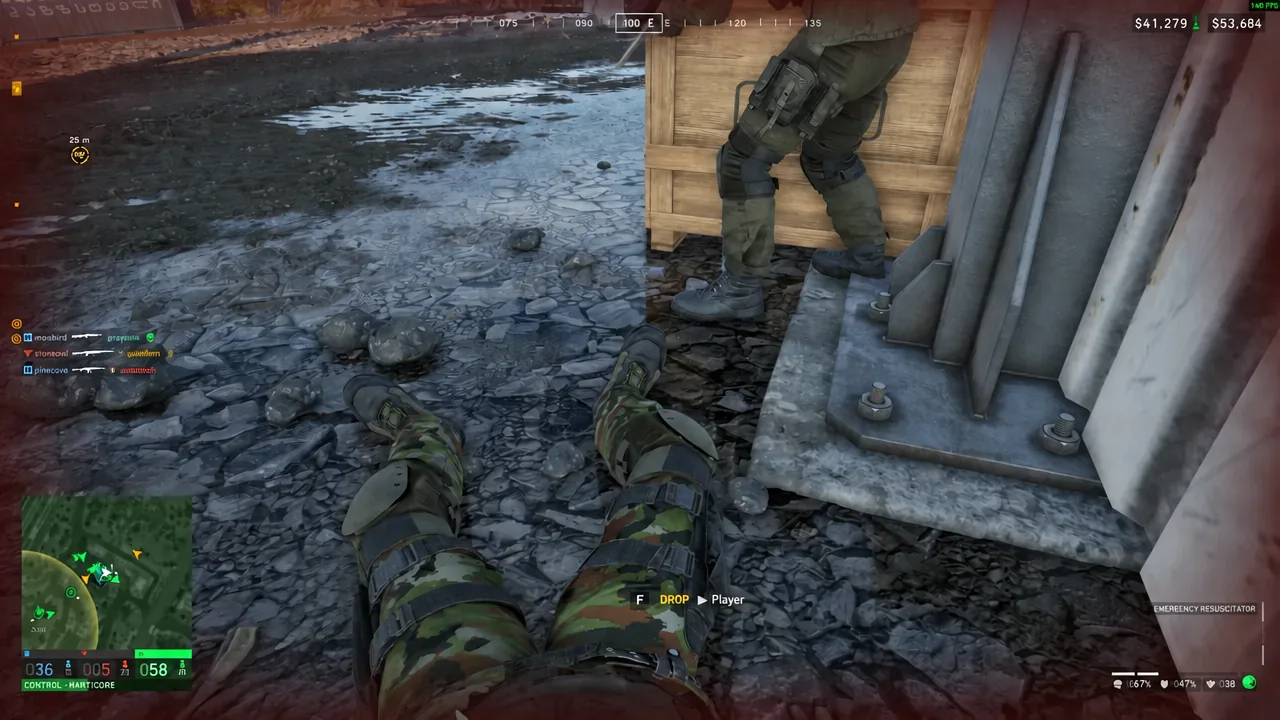 Downed teammate on the ground with the Emergency Resuscitator revive prompt on screen
