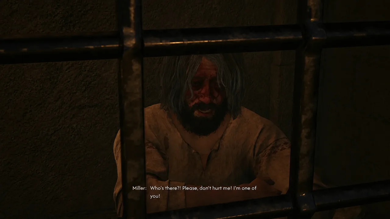 Mert behind the cell bars during dialogue, pleading with Coen not to hurt him
