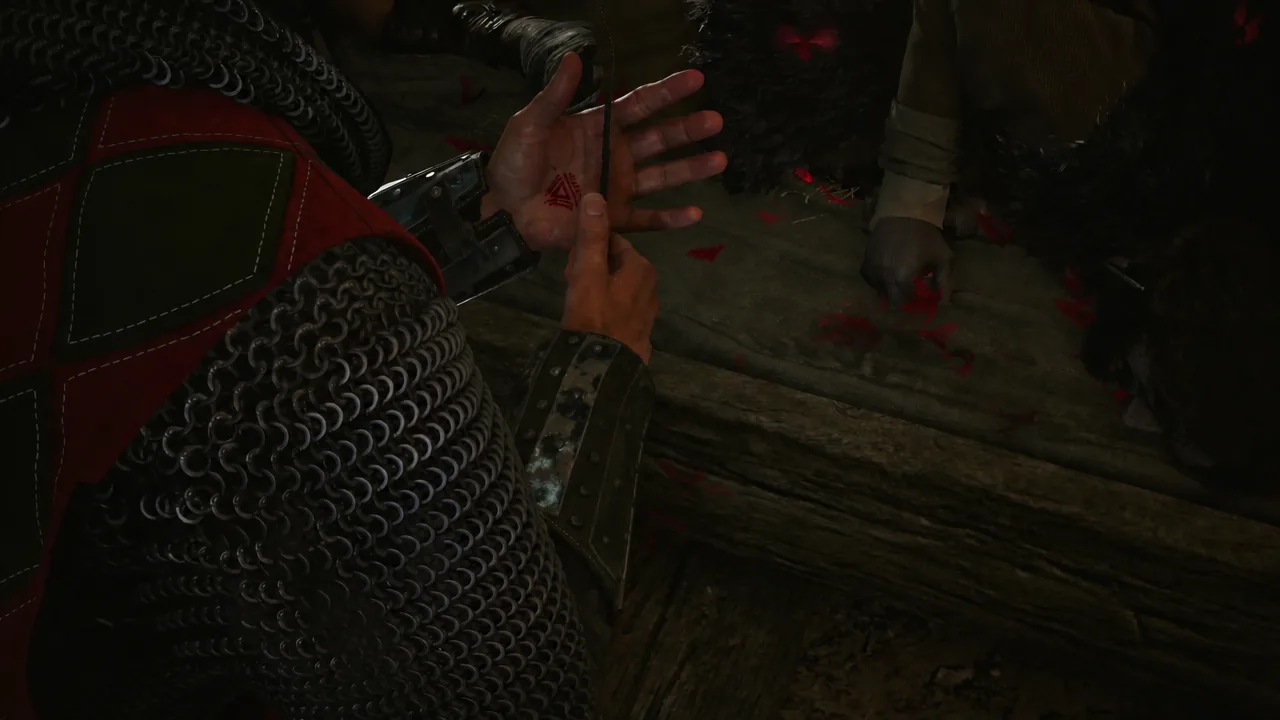 Cutscene of Coen cutting his open palm to draw blood for the seed