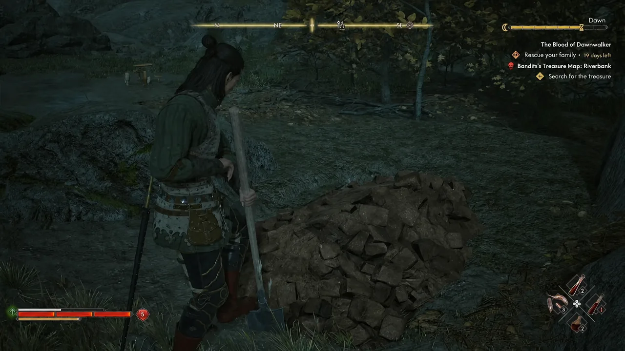 Search for the treasure objective active as the character stands beside a pile of rocks