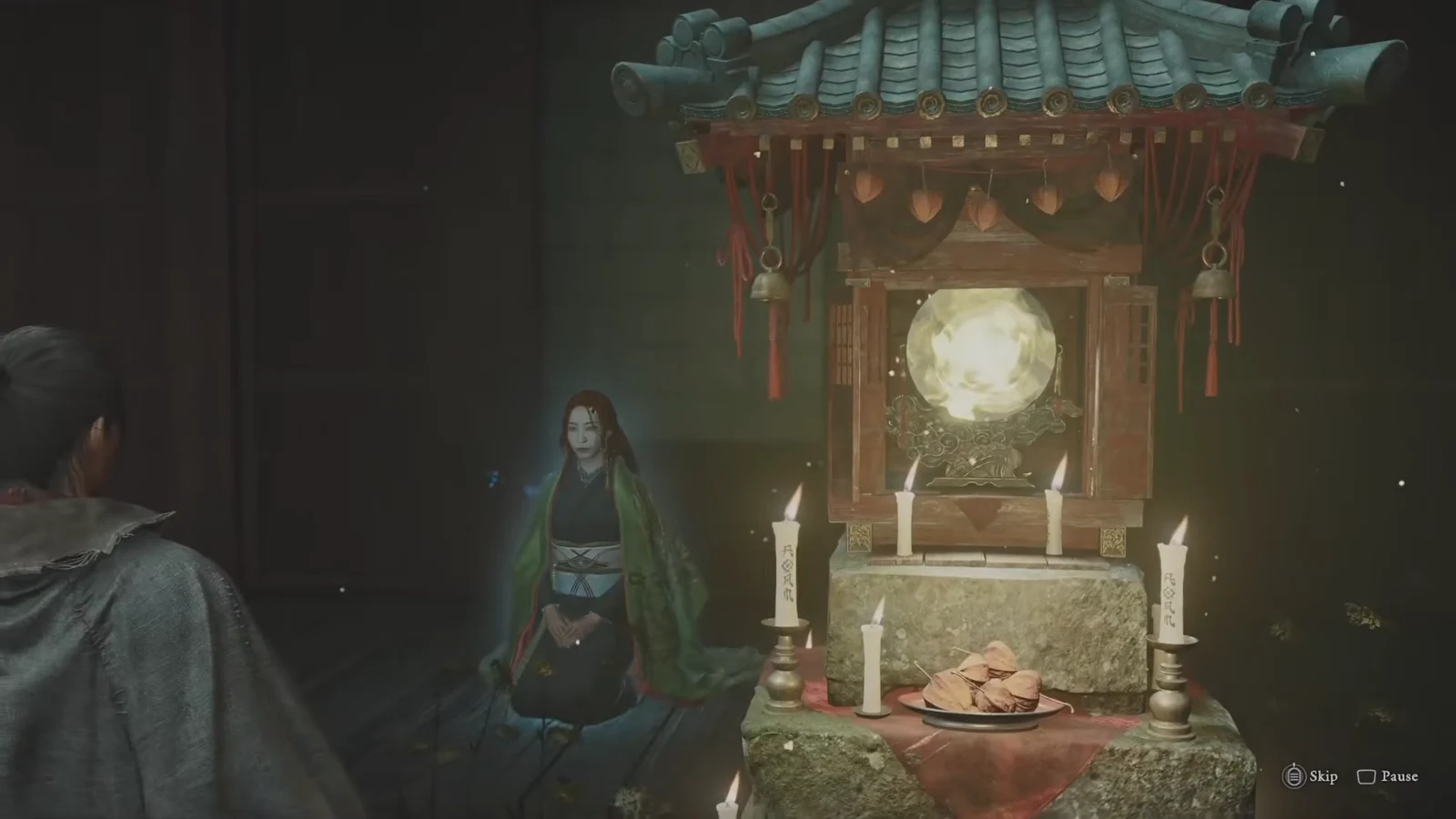 Shrine cutscene playing with skip and pause prompts in the corner of the screen