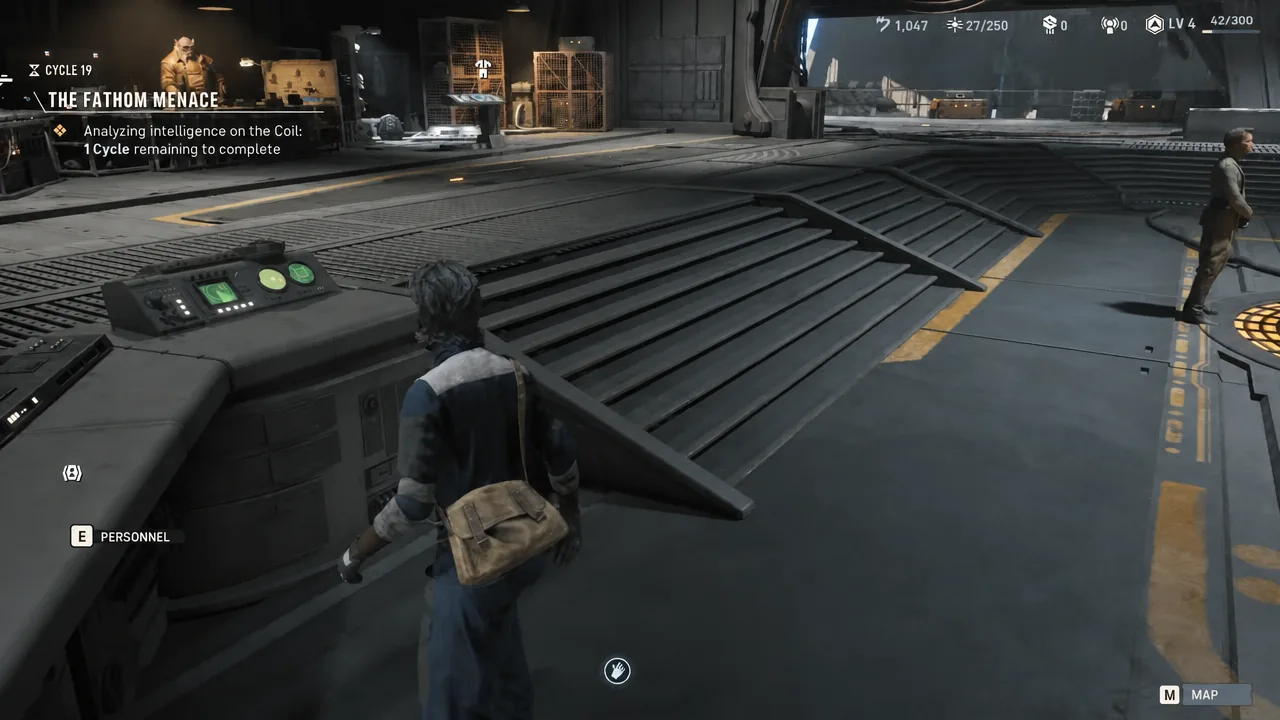Mission screen showing the E PERSONNEL prompt as the player walks up to the personnel console