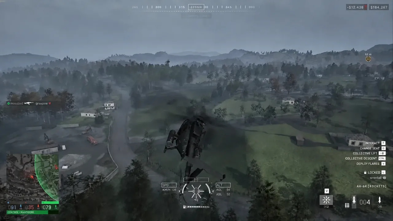 Rocket-armed AH-6R flying low over wooded terrain with flight controls shown on the right