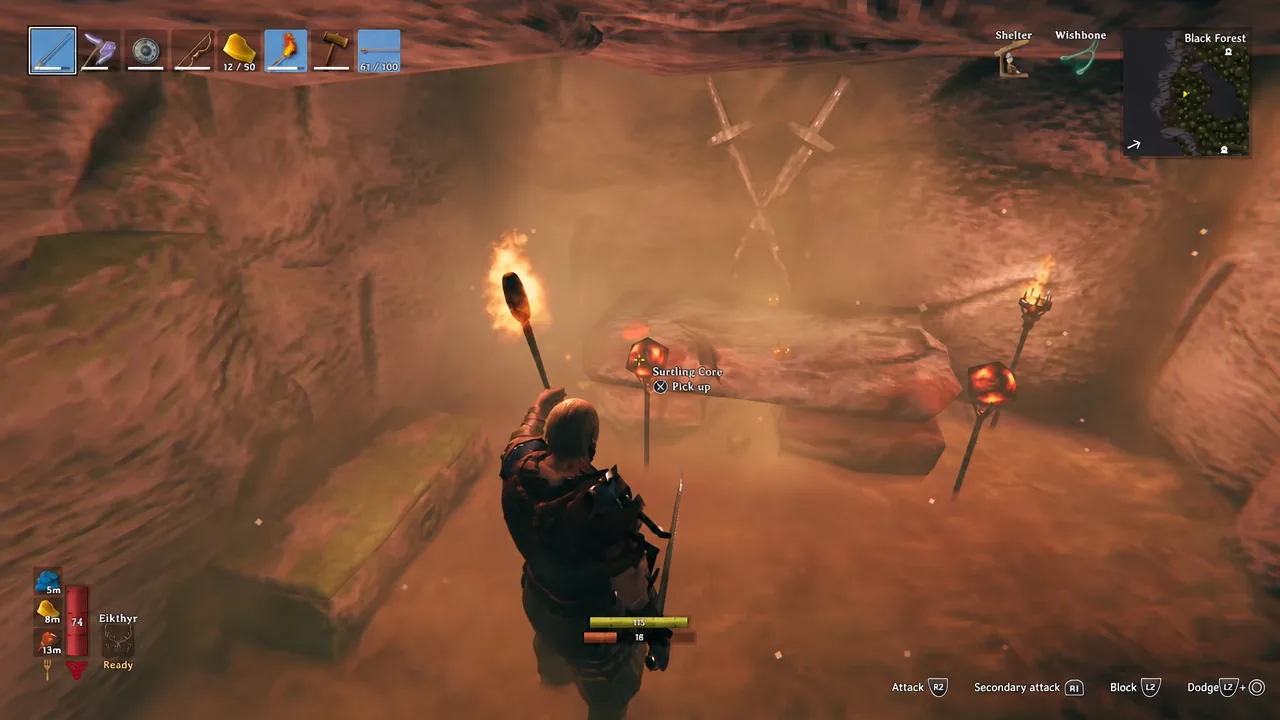 Surtling Core name and pick up prompt displayed inside a torch-lit Burial Chamber
