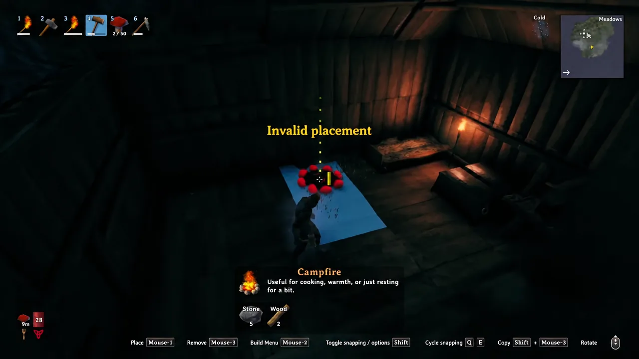 Valheim shelter interior at night with a bed and the status icons visible on screen